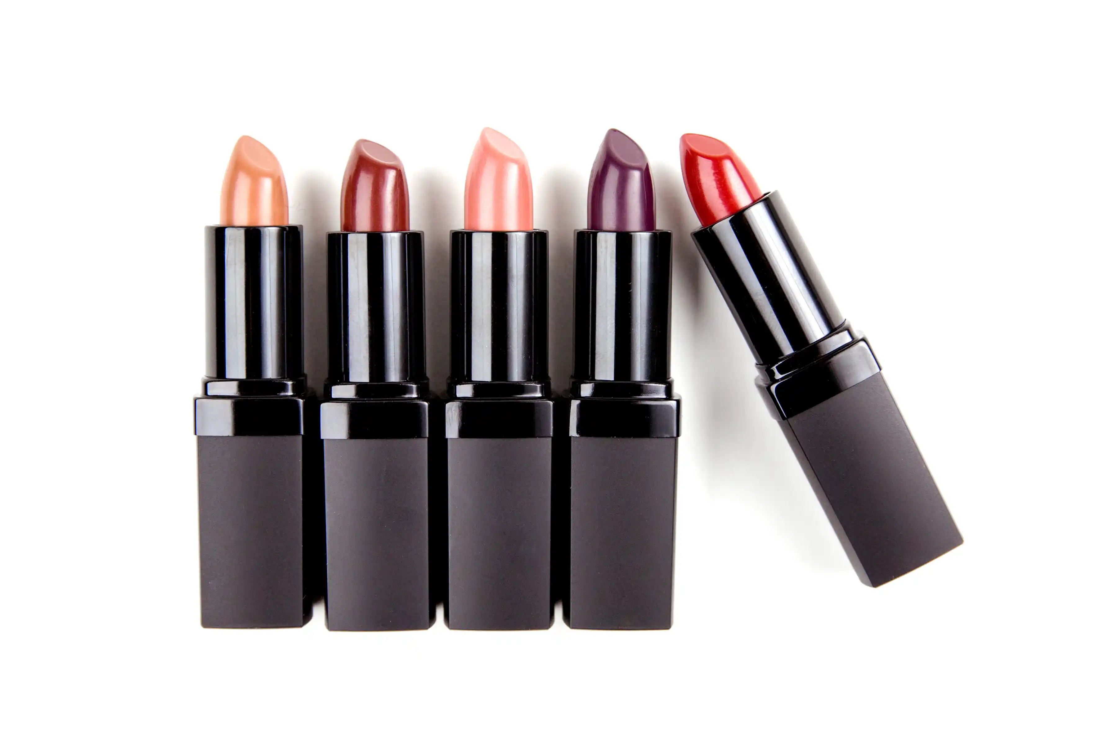 Five lipsticks in various shades.
